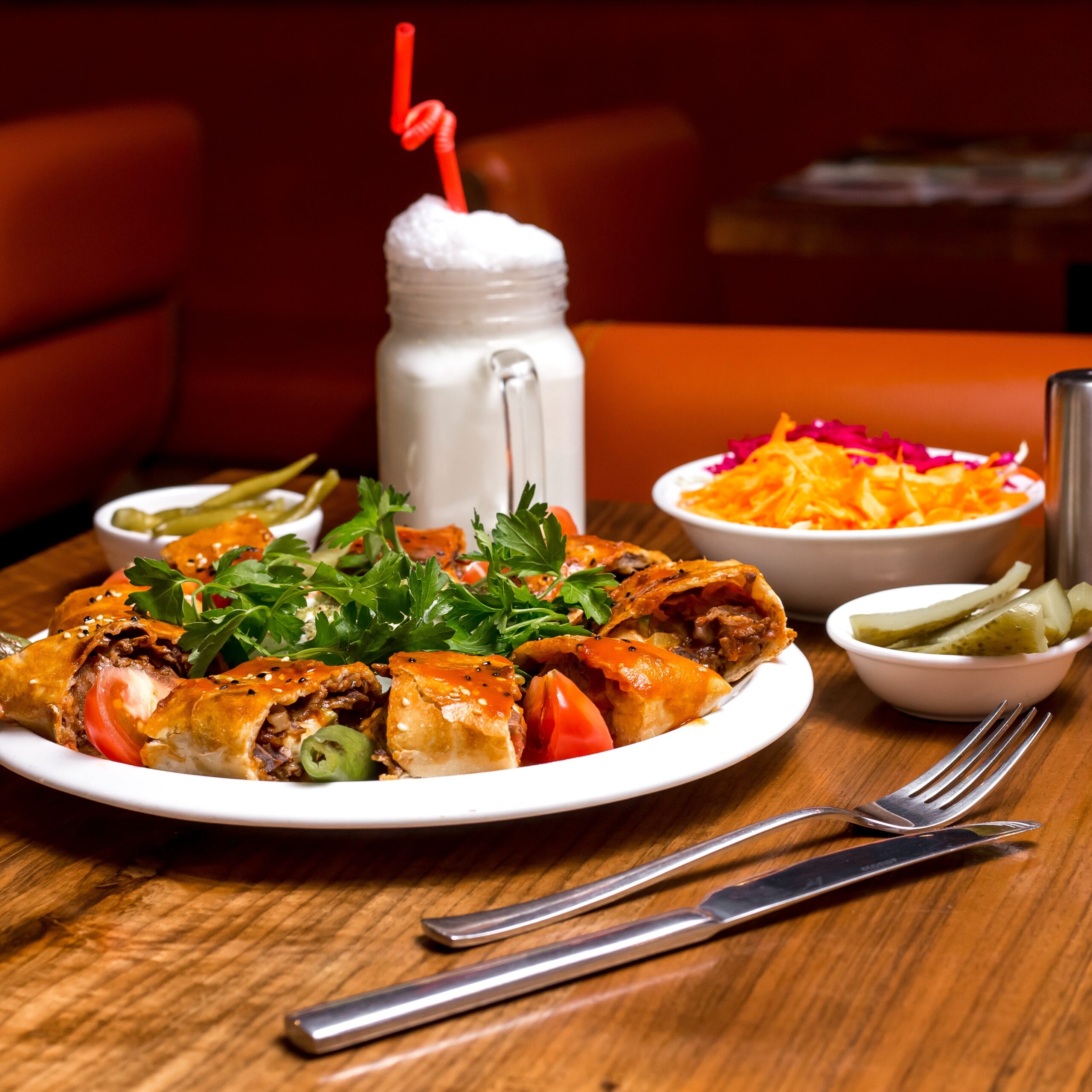 beyti kebab served with ayran and pickles